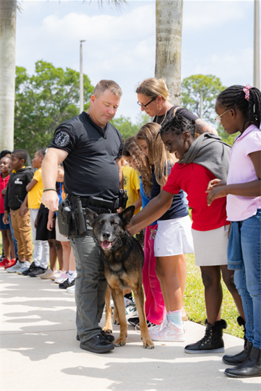 City-Hall-Field-Trip-group-petting-police-k9.png