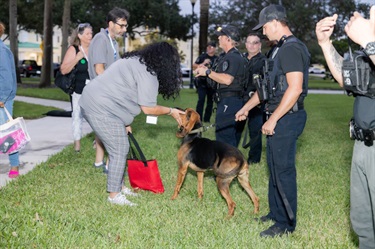 Participant petting K9 Officer
