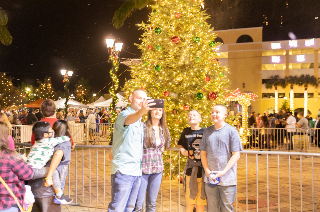 PSLinLights Christmas Tree at event center with family taking selfie