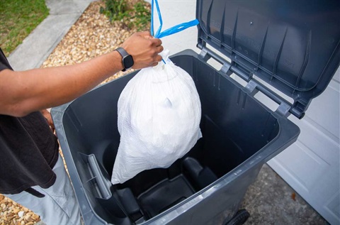 bagged garbage in cart