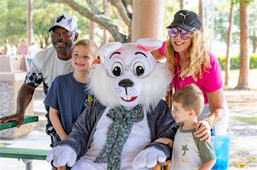 Eggstravaganza family taking photo with Easter Bunny 2