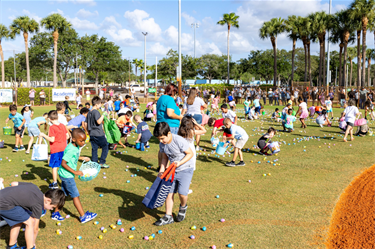 Eggstravaganza kids picking up eggs
