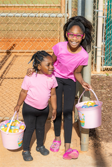 Eggstravaganza kids with buckets full of eggs
