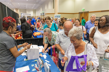 Hurricane Expo 2024 attendees at informational booths
