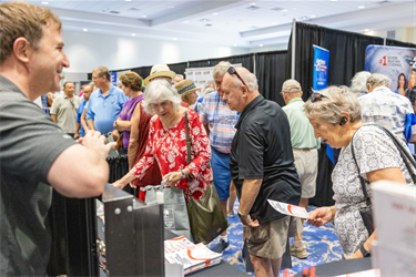 Hurricane Expo 2024 resident speaking with exhibitor